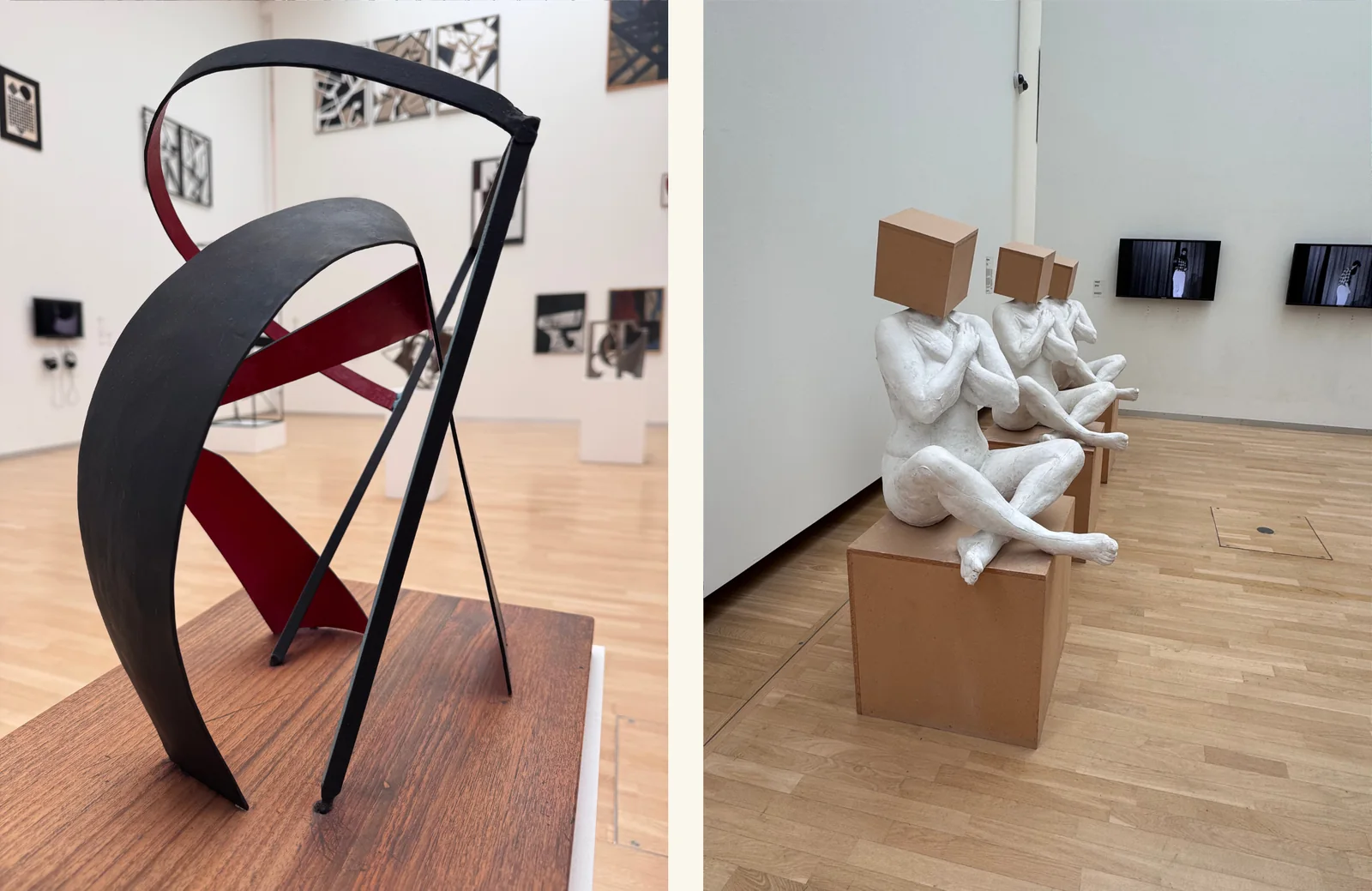 Left: a curved black and deep red steel sculpture on a wooden plinth in a densely hung gallery. Right: three white seated figures with cardboard boxes for heads, lined up on plinths opposite a row of small screens.