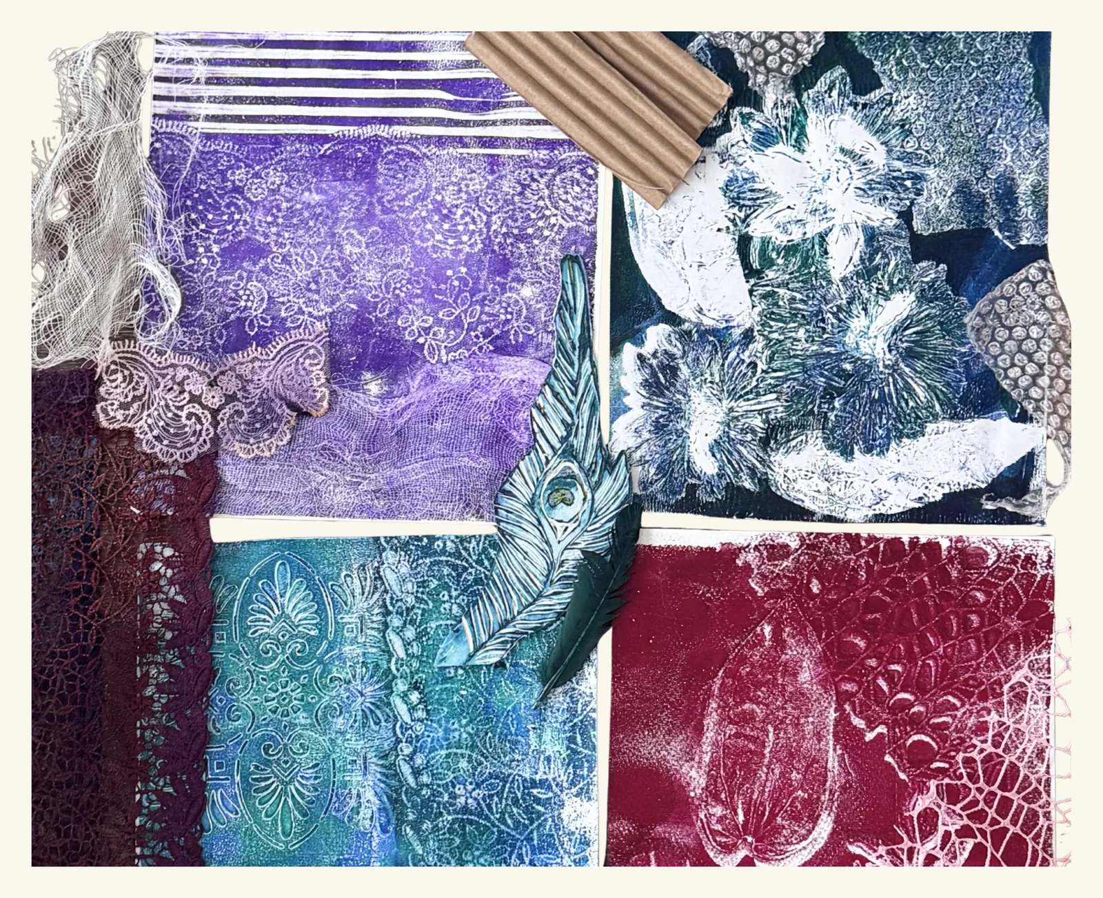 A flat-lay of four gel plate monoprints - purple with stripes and lace, navy with white flower bursts, teal with a raised damask pattern and deep red with a seed pod and lace - surrounded by vintage lace, medical gauze, corrugated cardboard, bubble wrap and a hand-painted peacock feather.